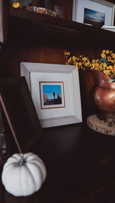 Farmhouse Photo Frame Next to a Vintage Copper Bucket