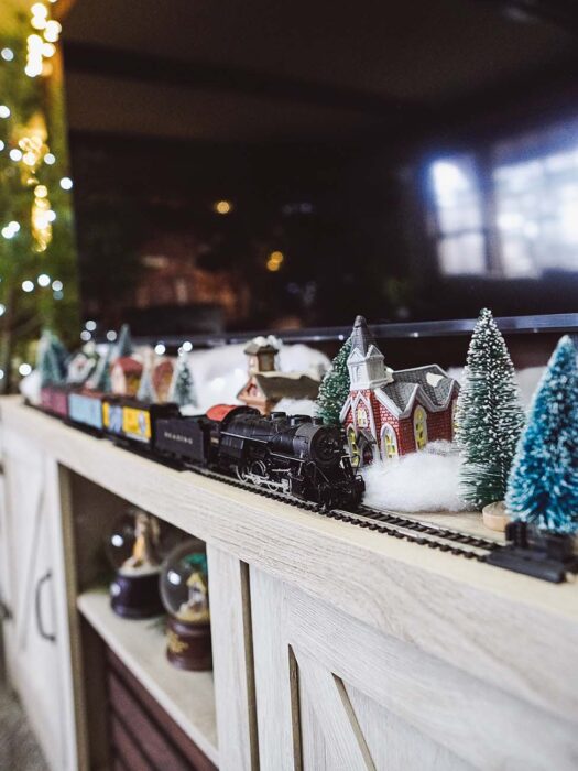 Model Trains for Christmas Decor on TV Stand
