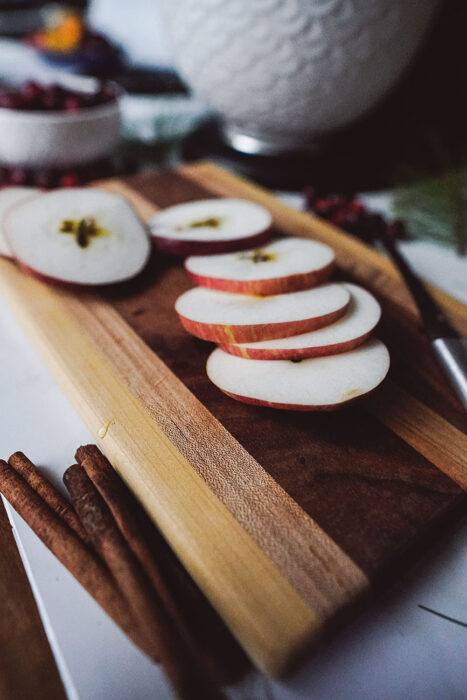 Sliced Apples on a Wooden Cutting Board in the Kitchen