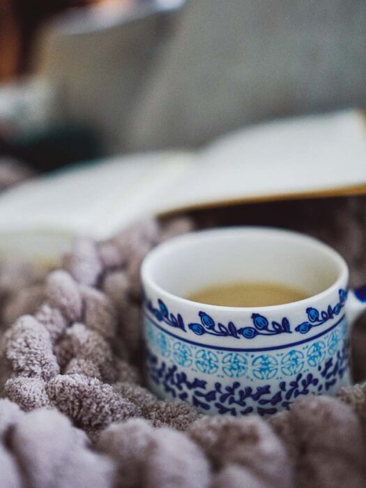 Cup of Coffee in a Cozy Blanket