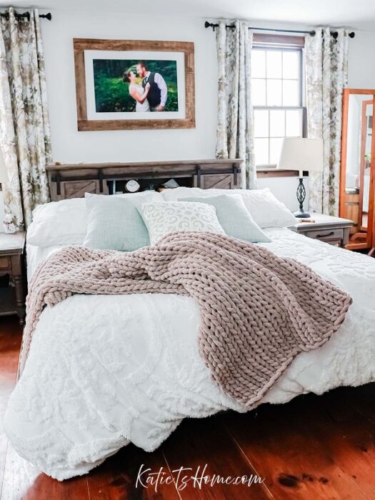 Neutral Colored Modern Farmhouse Master Bedroom with White Comforter and Beige Chunky Throw Blanket