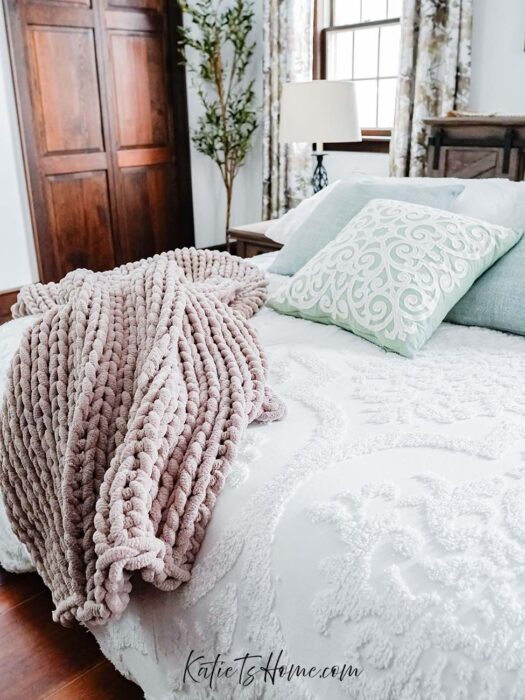 Stunning Farmhouse Master Bed with Tan Chunky Knit Blanket